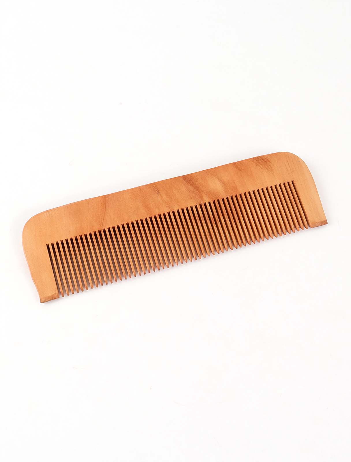 A natural wood comb in a rectangular shape