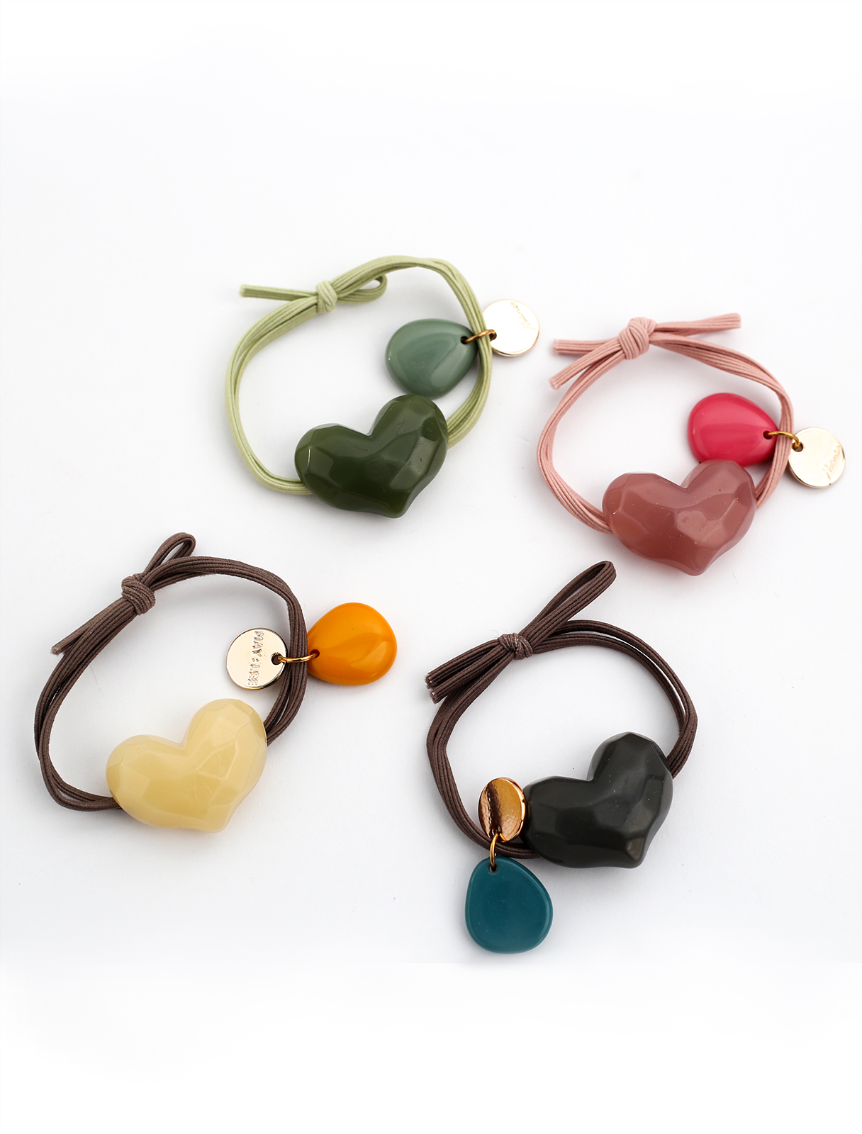 Color hair tie in the shape of a heart of natural stone
