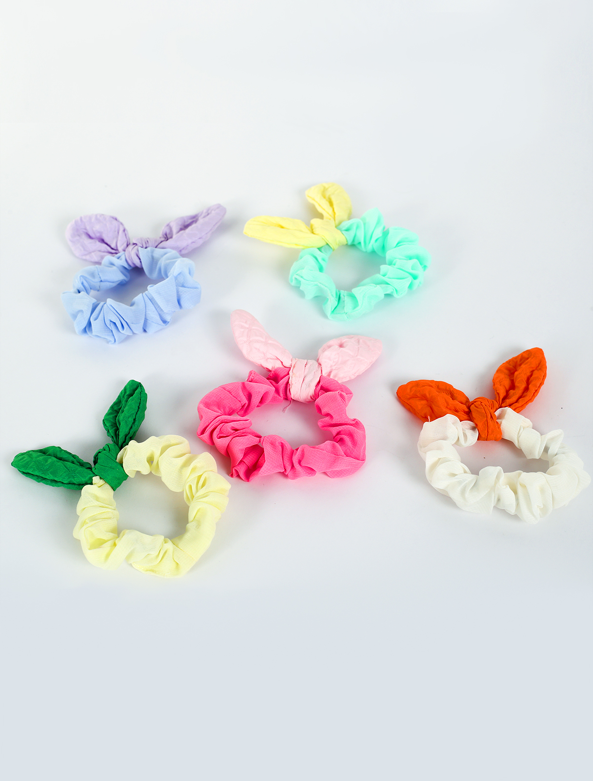 A hair tie, fabric colors, in the form of a bow
